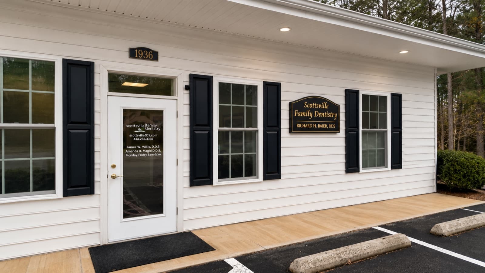Front entrance of Scottsville Family Dentistry, white-clapboard building with black shutters